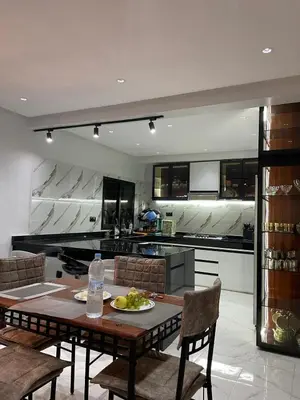 a kitchen with a table with a plate of food on it at Spacious 2 bedroom apartment 6 people 5 min from Marrakech center in Marrakech