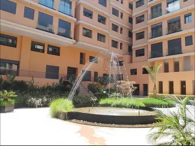 a water fountain in front of a building at Marrakech Elite Garden, moderne, chaleureux, tout équipé in Marrakech