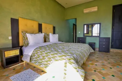 a bedroom with a large bed in a room at Luxury Villa in Marrakech