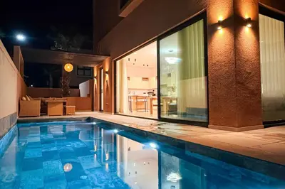 a swimming pool in the middle of a room with at Villa SeanJezTagana in Marrakech