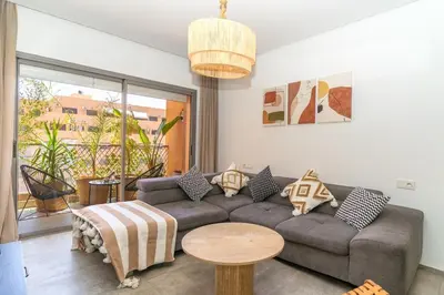 a living room with a couch and a table at Appartement gueliz, hyper centre in Marrakech