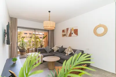 a living room with a couch and a table at Appartement gueliz, hyper centre in Marrakech