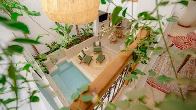 an overhead view of a pool in a house with plants at Private Riad Loulou Zitoun - rooftops - 2 pools - 4 rooms in Marrakech