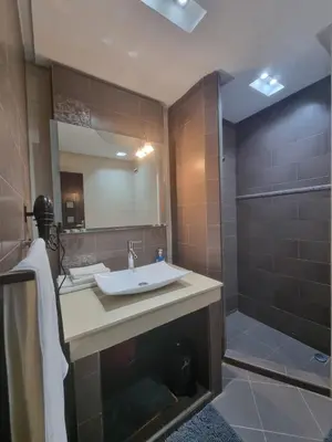 a bathroom with a sink and a shower at Appartement Gueliz Carré Eden 90m2 idéalement placé in Marrakech