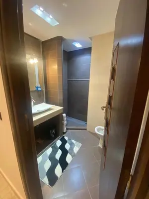 a bathroom with a sink and a toilet at Appartement Gueliz Carré Eden 90m2 idéalement placé in Marrakech