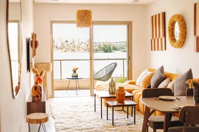 a living room with a couch and a table at Z-series Appartement unique et moderne in Marrakech
