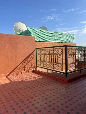 a fence on top of a building at Riad butterfly marrakech 2 in Marrakech