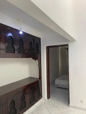 a room with a room with a bed and a mirror at Riad butterfly marrakech 2 in Marrakech