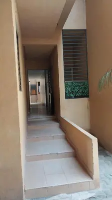 a stairway leading into a building with a window at Beautiful apartment with children's pool in Marrakech