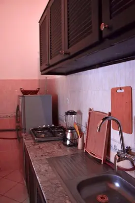 a kitchen with a sink and a counter top at Quiet apartment of traditional Moroccan in Marrakech