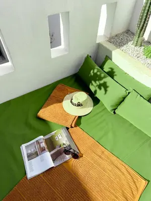 a small living room with a table and a couch at Riad Akwaba Charm and Comfort in Marrakech