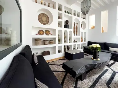 a living room with a couch and a table at Riad Akwaba Charm and Comfort in Marrakech