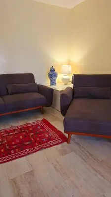a living room with two couches and a table at La Terrasse in Marrakech