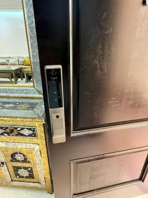a close up of a door with a mirror at Duplex 160M Piscine WIFI Parking in Marrakech