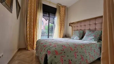 a bedroom with a bed and a window at Dar Saad Atlas golf in Marrakech