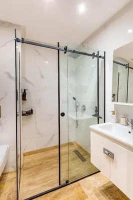a bathroom with a shower and a sink at La Parenthèse Urbaine - Patio Berbère in Marrakech