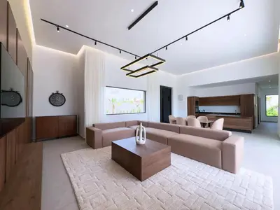 a living room with a couch and a table at Villa Signature - Élégance , Confort en Double in Marrakech