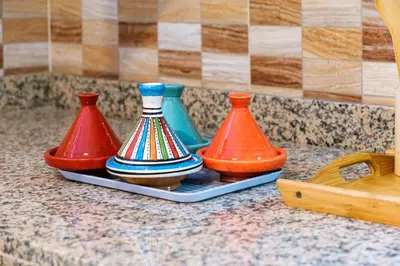 three different colored vases sitting on a counter at 1Br & private garden perfect location in Marrakech in Marrakech