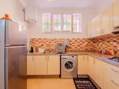 a kitchen with a washer and a dishwasher at 1Br & private garden perfect location in Marrakech in Marrakech