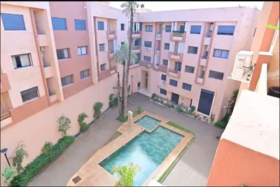 an overhead view of an apartment building with a swimming pool at Appartement neuf et moderne Marrakech in Marrakech