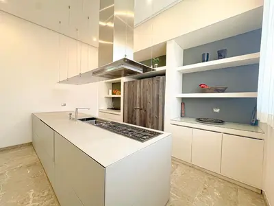 a kitchen with white cabinets and a stove top oven at Villa Leonardo in Marrakech