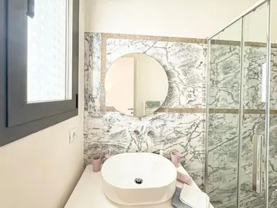 a bathroom with a sink and a mirror at Villa Leonardo in Marrakech