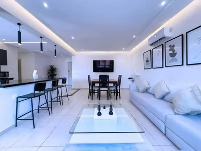 a living room with a couch and a table at Appart Confort et raffinement au cœur de Marrakech in Marrakech