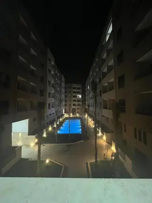 a view of a pool in a building at night at Leila in Marrakech