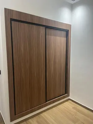 a pair of wooden doors in a room at Leila in Marrakech