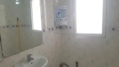 a bathroom with a sink and a mirror at Home for peace & enjoyment in Marrakech
