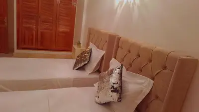 a bed with two pillows on it in a room at Appartement Majorella Gueliz Centre Marrakech in Marrakech