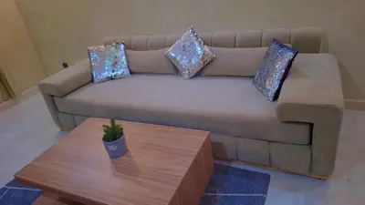 a living room with a couch and a coffee table at Appartement Majorella Gueliz Centre Marrakech in Marrakech