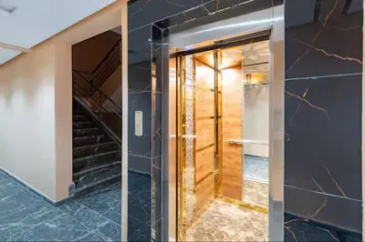 a hallway with a glass door and stairs at Cozy Studio in Hivernage 31 in Marrakech