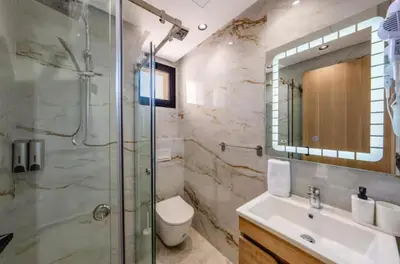 a bathroom with a shower and a toilet and a sink at Cozy Studio in Hivernage 31 in Marrakech