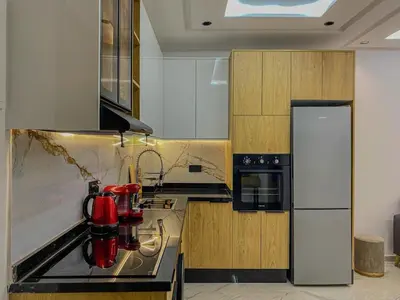 a kitchen with a stove and a refrigerator at Cozy Studio in Hivernage 31 in Marrakech
