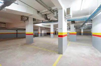 an empty parking lot with columns in a parking garage at Cozy Studio in Hivernage 31 in Marrakech