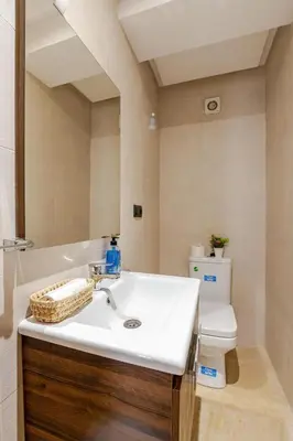 a bathroom with a sink and a toilet at Urban Comfort - Pool - Netflix IPTV Parking in Marrakech