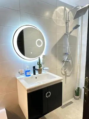 a bathroom with a sink and a mirror at Riad apartment Beldi style in Marrakech
