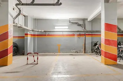 an empty parking lot with a garage with motorcycles at Modern Elegance & Moroccan Charm - Gueliz Center in Marrakech