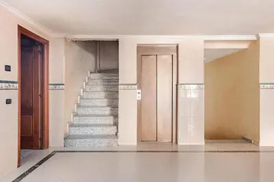 an empty room with stairs and a door at Modern Elegance & Moroccan Charm - Gueliz Center in Marrakech