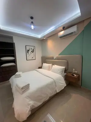 a bedroom with a large white bed in a room at Central nest romantic stay in Marrakech