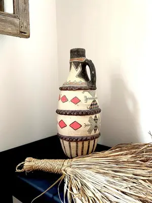 a vase sitting on top of a table at Riad Madame Riad privé à deux pas de la Place Jemaa El Fna in Marrakech