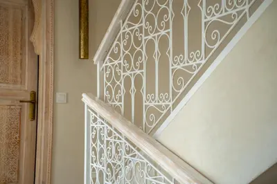 an ornate stenciled stairway in a house at Riad JAIA in Marrakech