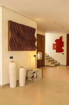 a room with two vases and a painting on the wall at Villa Dar Al Jaddah, Luxury and Refinement in Marrakech