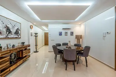 a dining room with a table and chairs at Urban Dream piscine et central in Marrakech