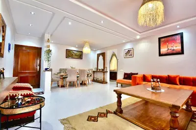 a living room with a couch and a table at DarKech luxury and comfort in Marrakech