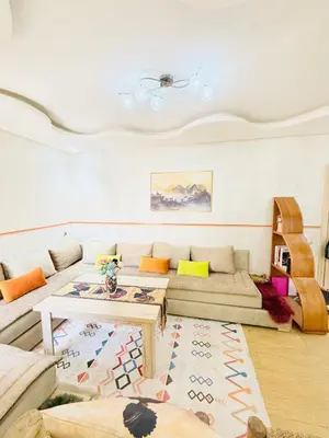a living room with a couch and a table at Full Moon Marrakech in Marrakech