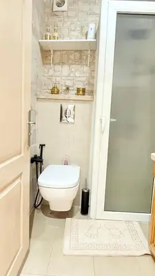 a bathroom with a toilet and a glass door at Full Moon Marrakech in Marrakech