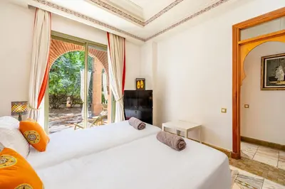 two white beds in a room with a window at La Palmeraie 2BR Garden & Pool in Marrakech