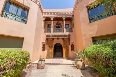 an entry to a building with a door and a courtyard at La Palmeraie 2BR Garden & Pool in Marrakech